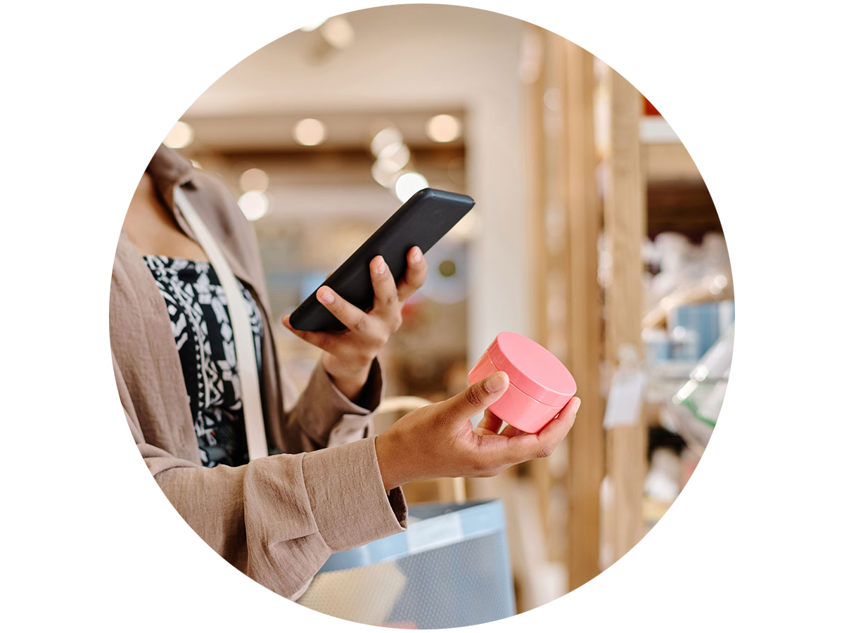 Person using their smart phone to check a personal care item at the store