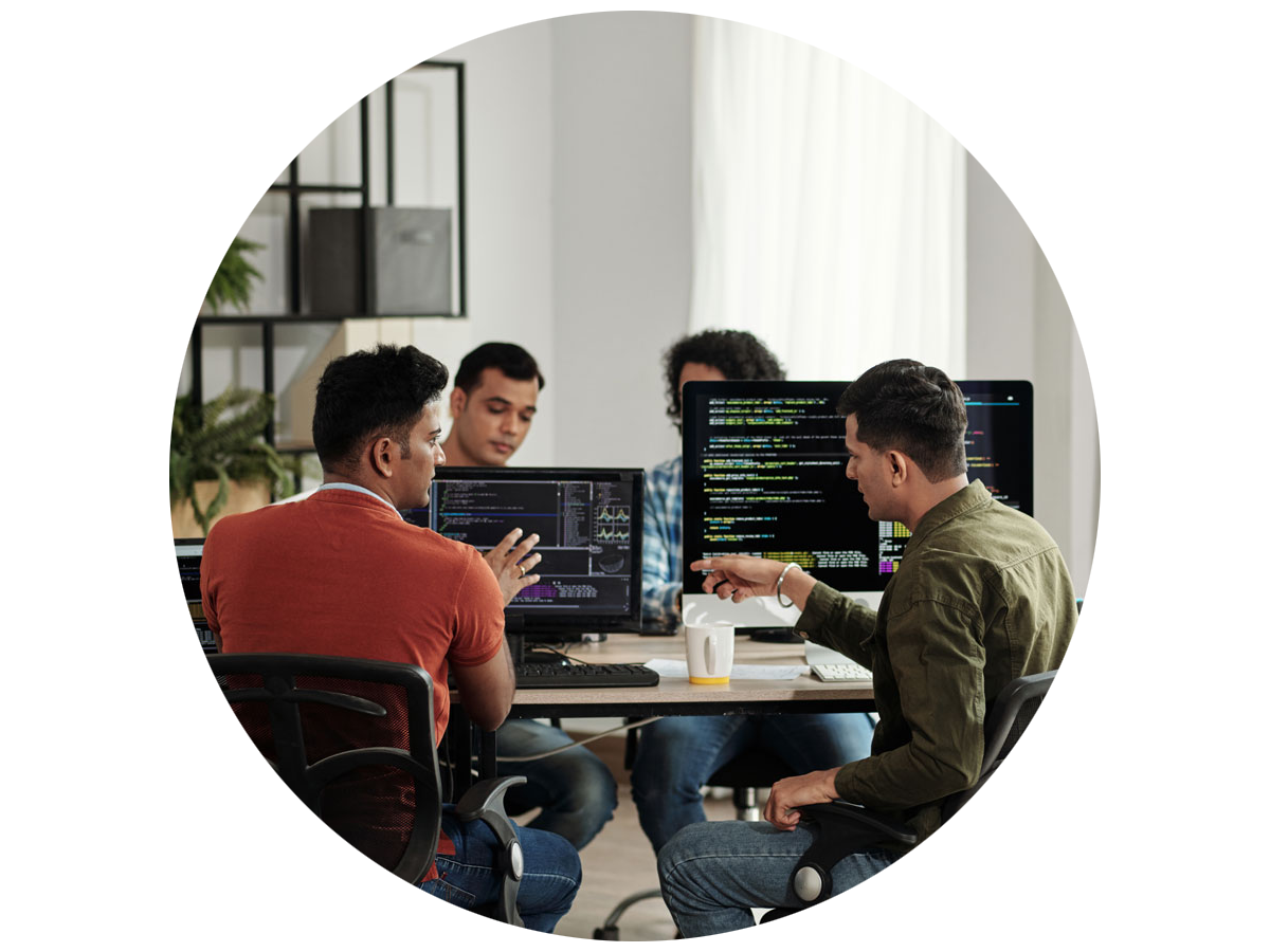 Four web developers discussing a program